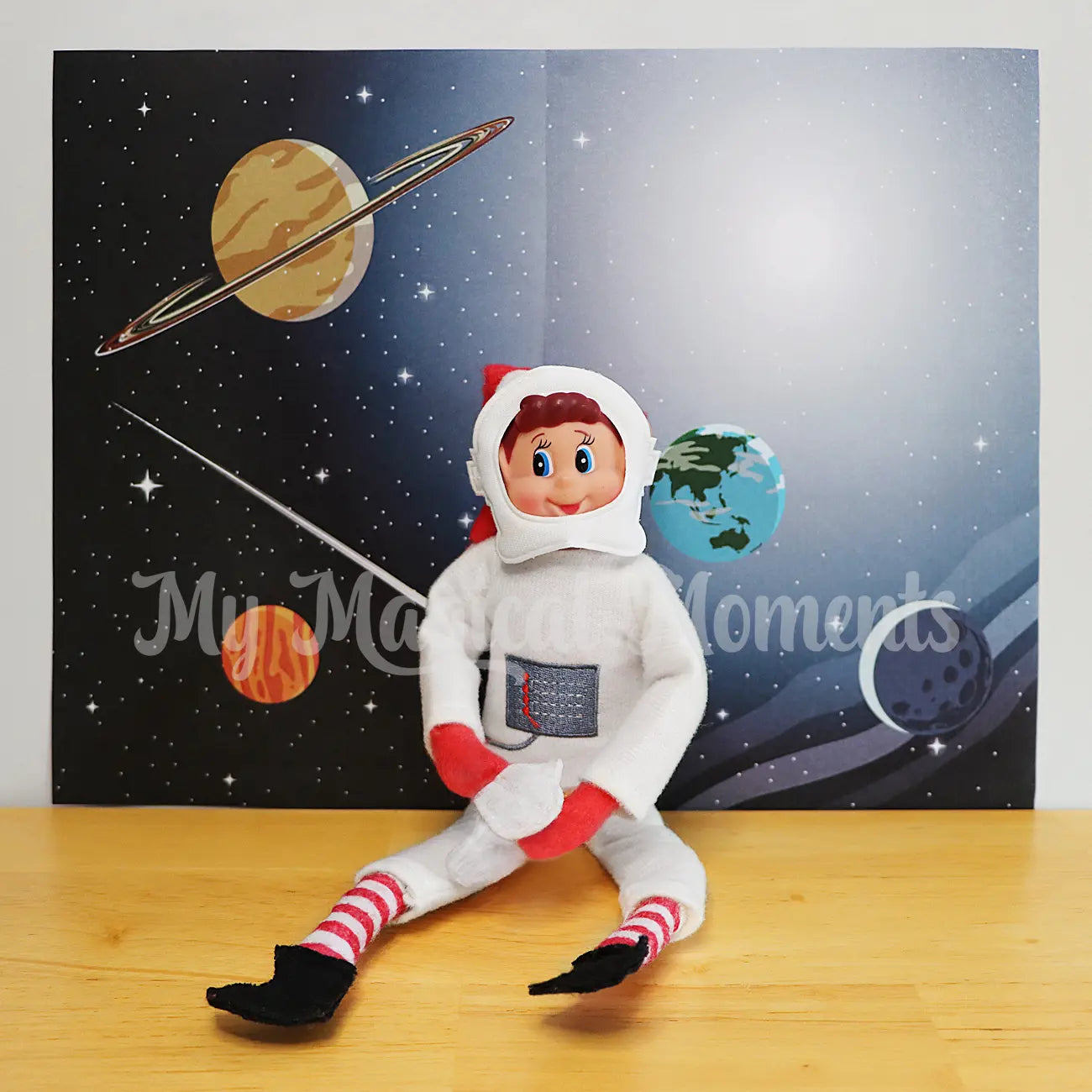 elf wearing an astronaut costume in front of a space printable