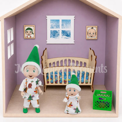 Elf toddler and elf baby wearing matching sleepwear