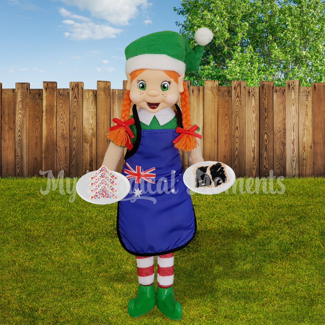 Girl elf wearing an aussie apron holding miniature fairy bread and vegemite