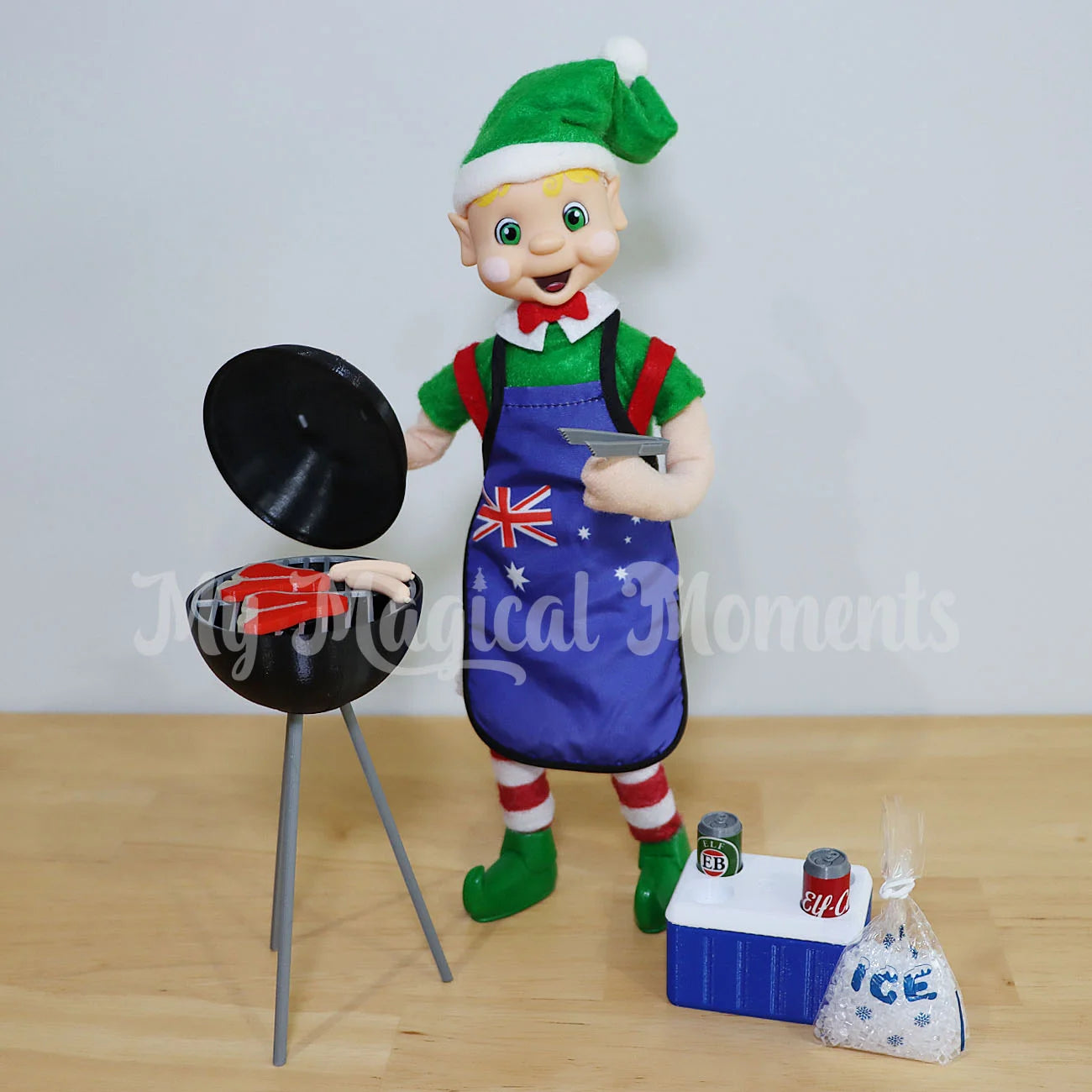 My Elf friend cooking on a mini bbq prop with a miniature esky and cola cans