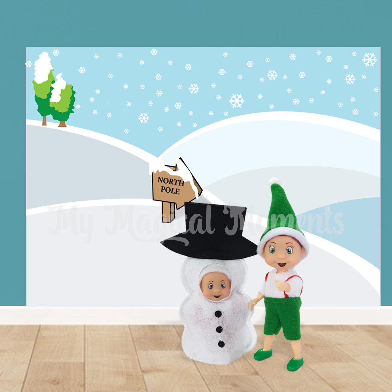 Elf baby dressed as snowman with toddler elf