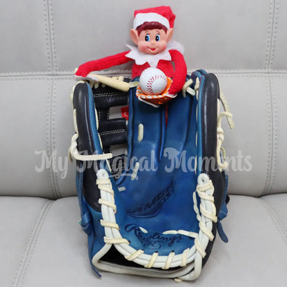 Elf on a baseball glove holding a miniature baseball glove and elf sized baseball bat