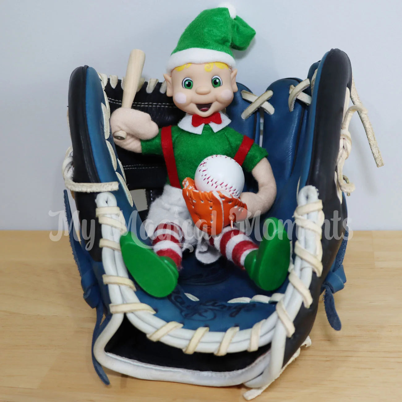 Elf Holding mini baseball in a baseball glove