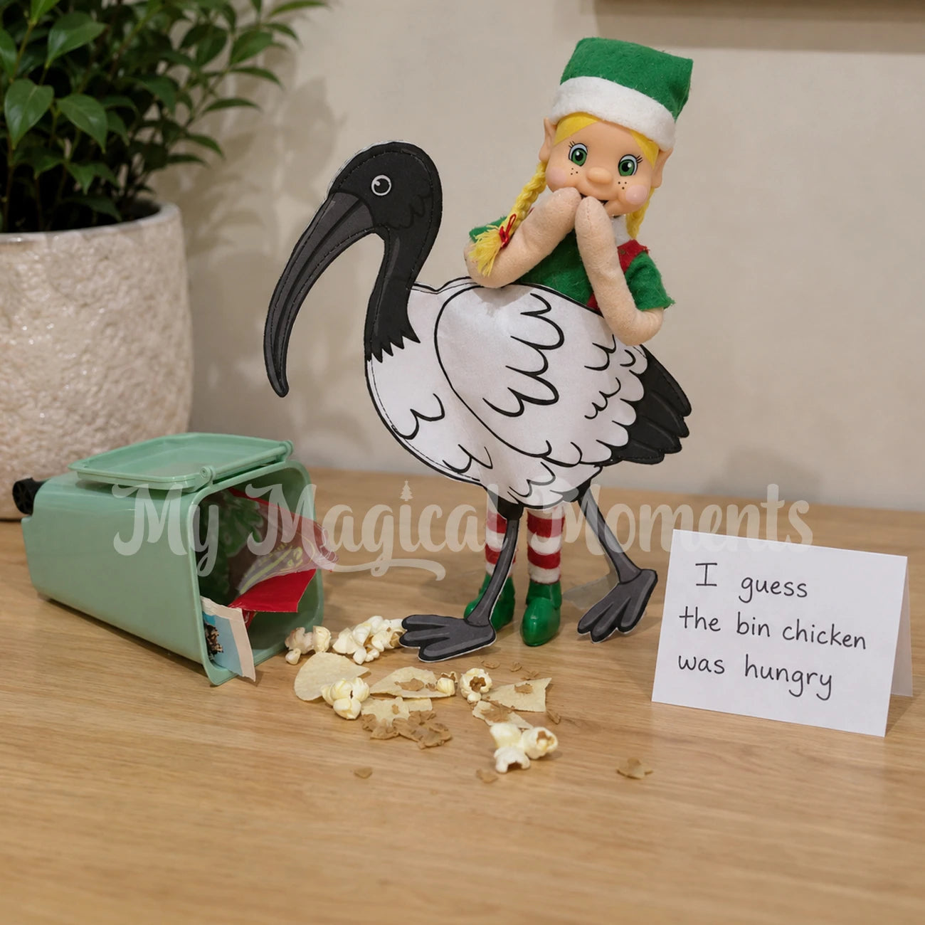 blonde hair my elf friends Elf wearing a bin chicken costume eating scraps out of a mini elf bin prop