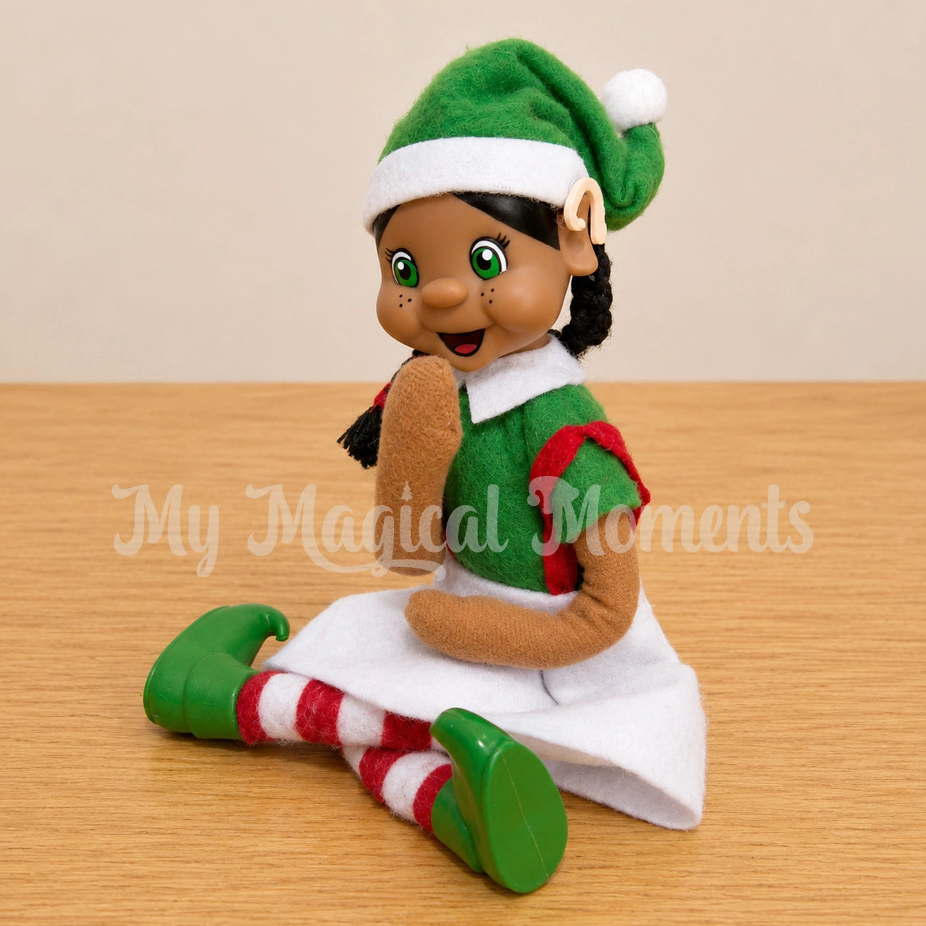 a black hair bendable elf wearing a mini hearing aid