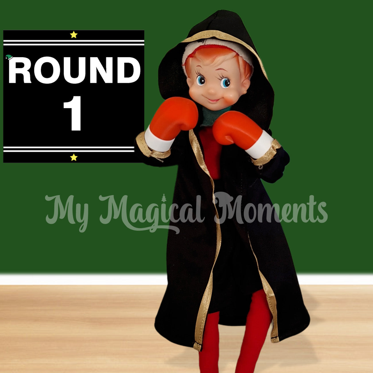 Elf dressed in a boxing outfit with a round one sign