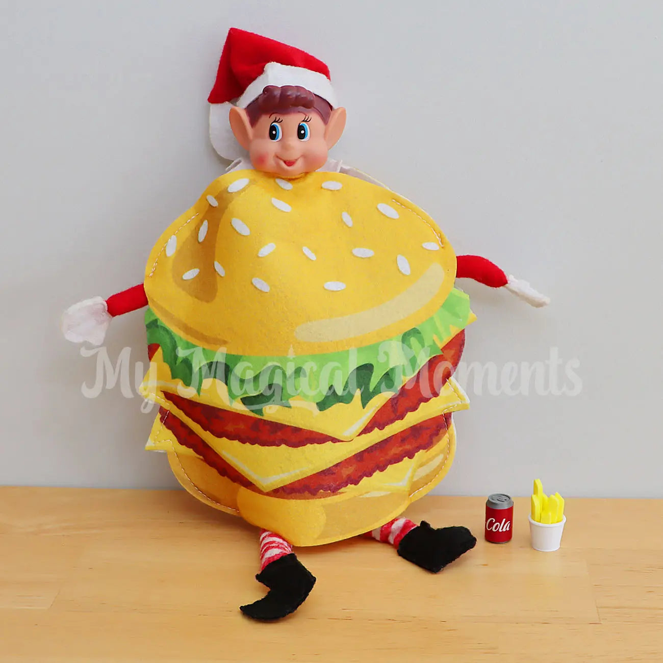 elf wearing a burger outfit with mini cola and fries