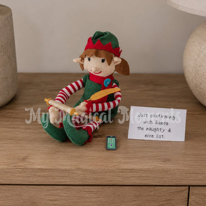 Elf filling out a naughty and nice list on a scroll with a quill for Santa. They are calling Santa on their mini phone