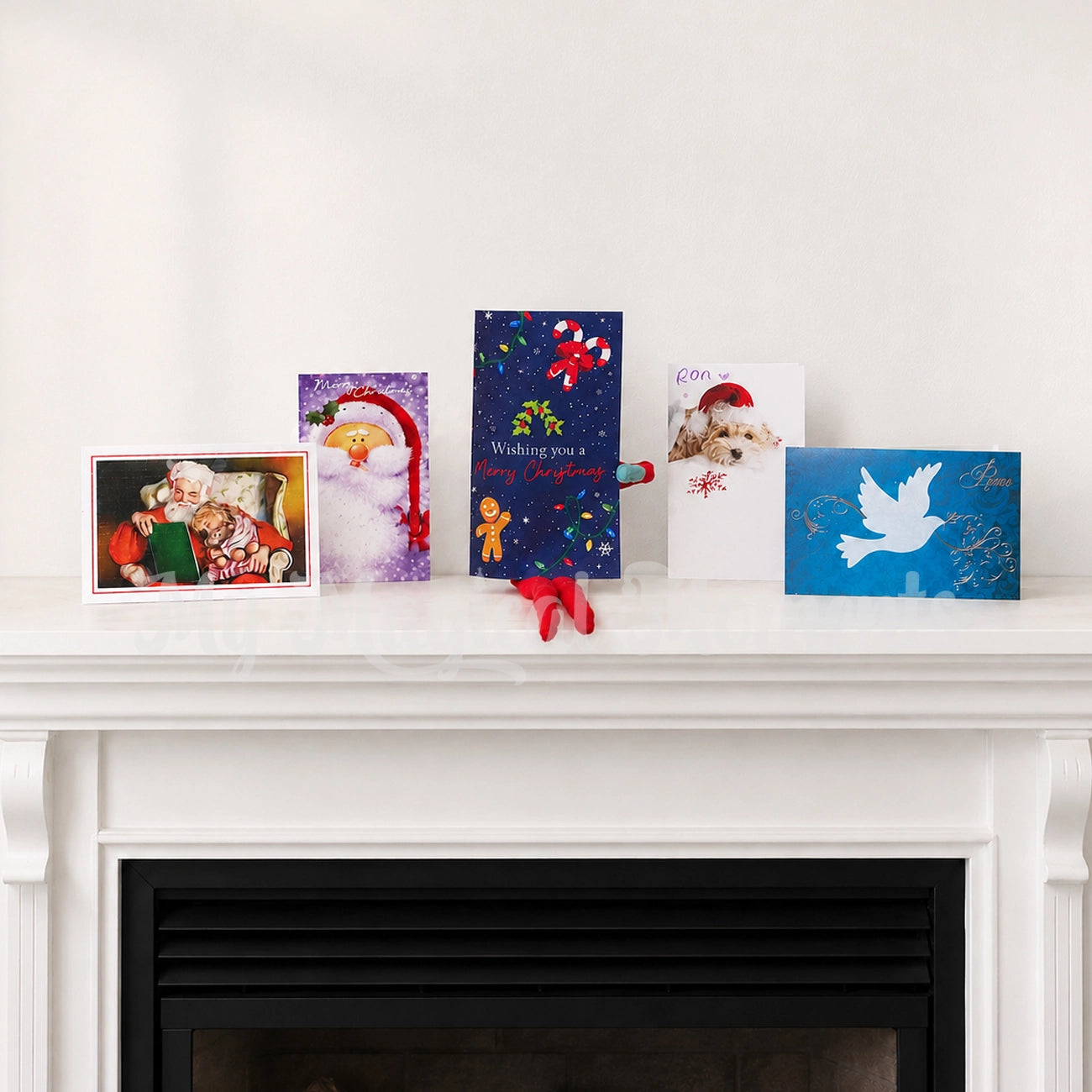Elf Shelf Wearing a Christmas Card Costume amongst Christmas cards on a fireplace