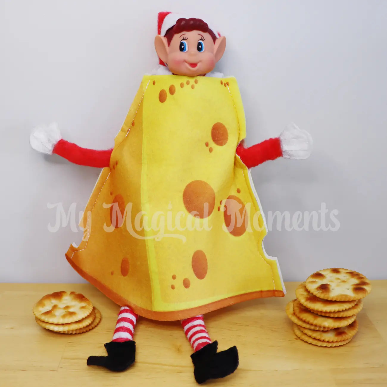 Elves behavin badly wearing a elf cheese costume with crackers