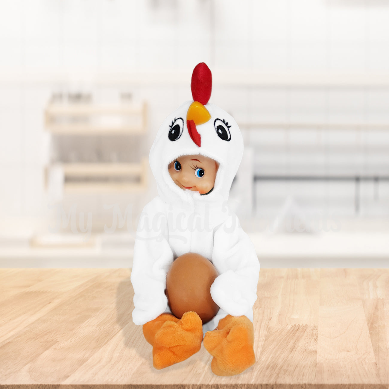Elf dressed as a chicken holding an egg in the kitchen