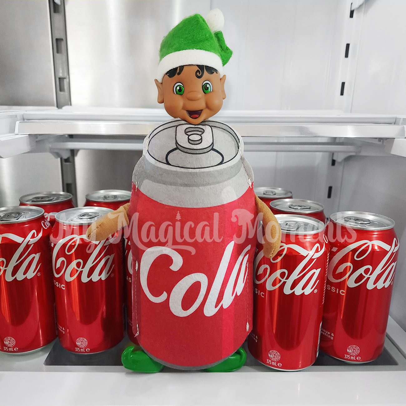 Elf wearing a cola can costume in the fridge