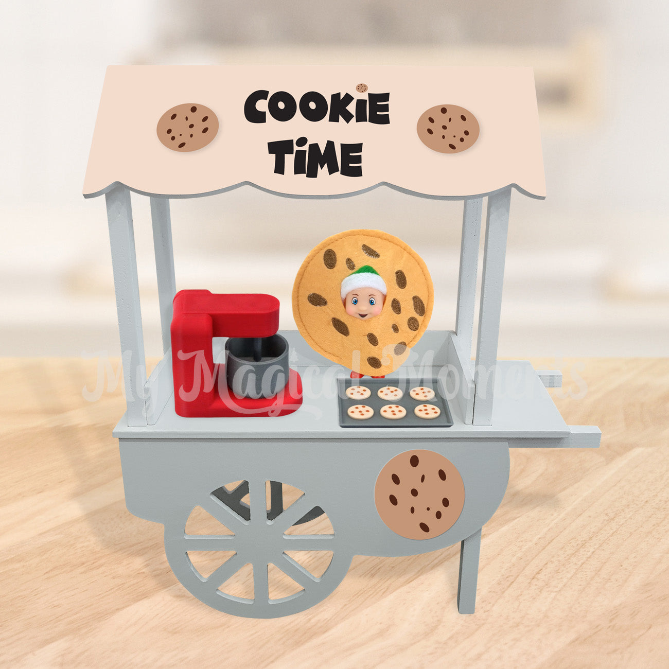 miniature Cookie store with an elf baby dressed as cookie and a red baking set
