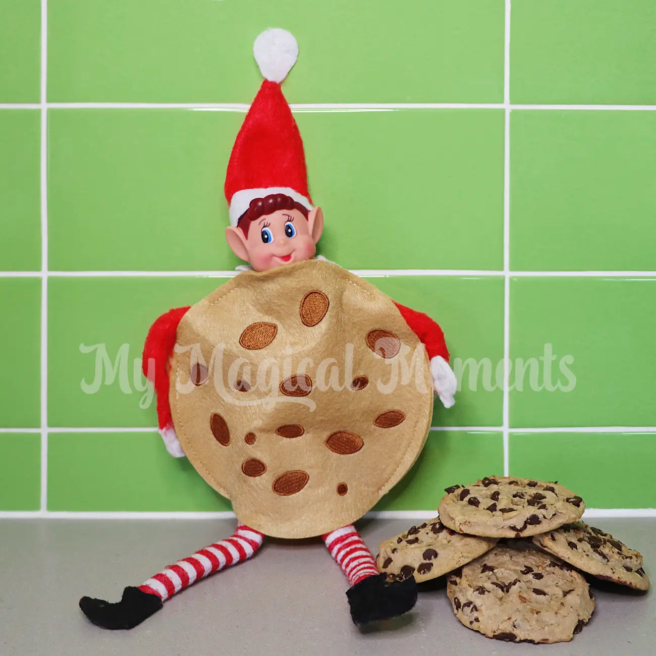 elf wearing a cookie costume with min cookies