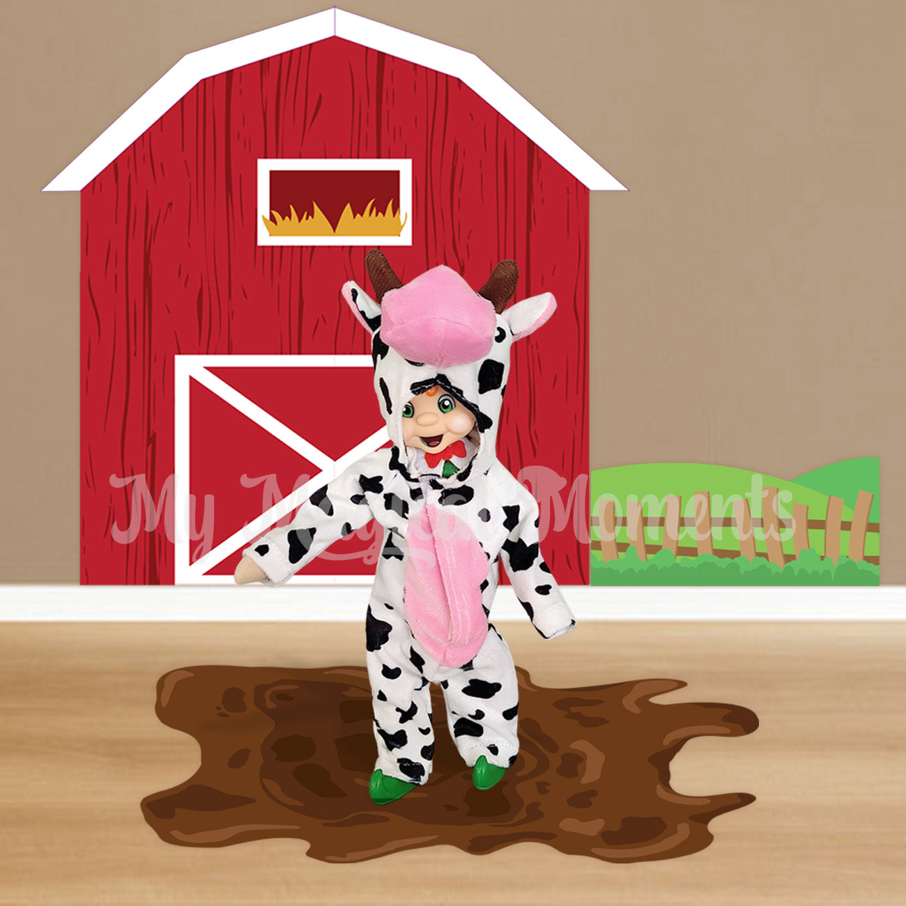 Elf wearing a cow costume standing in printable mud puddle with a barn behind