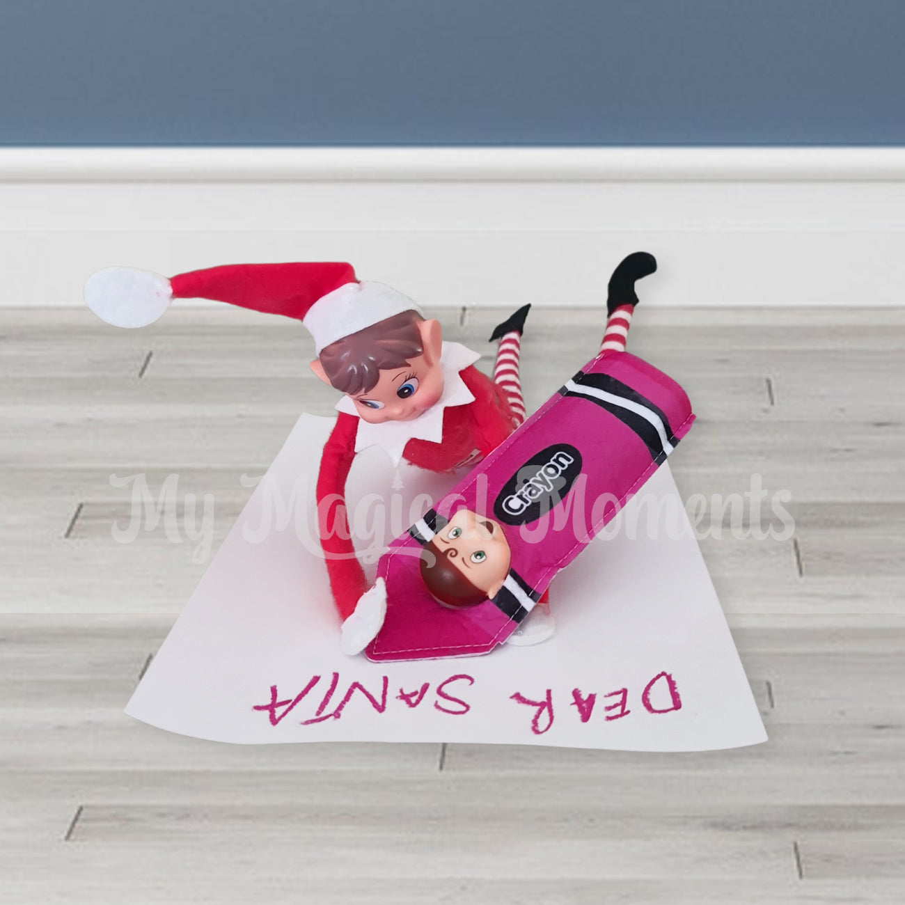 Elves behavin badly elf writing a letter to santa with a elf toddler dressed as a purple crayon
