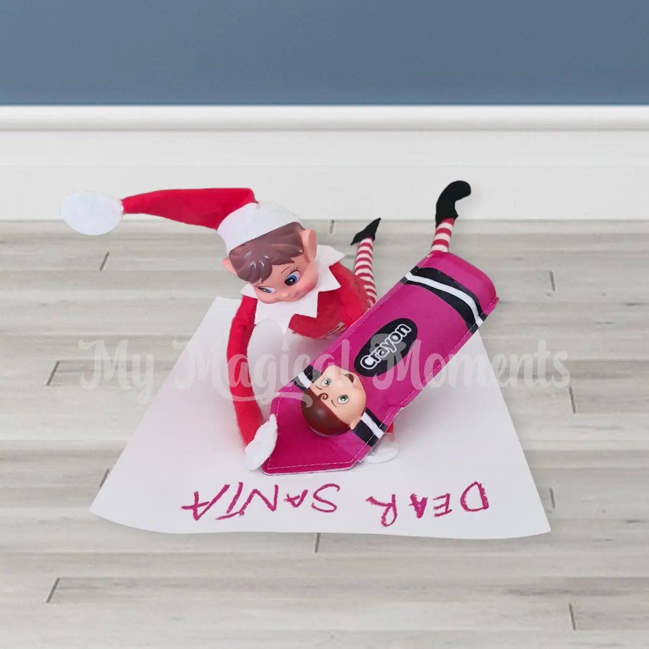 Elves behavin badly elf writing a letter to santa with a elf toddler dressed as a purple crayon