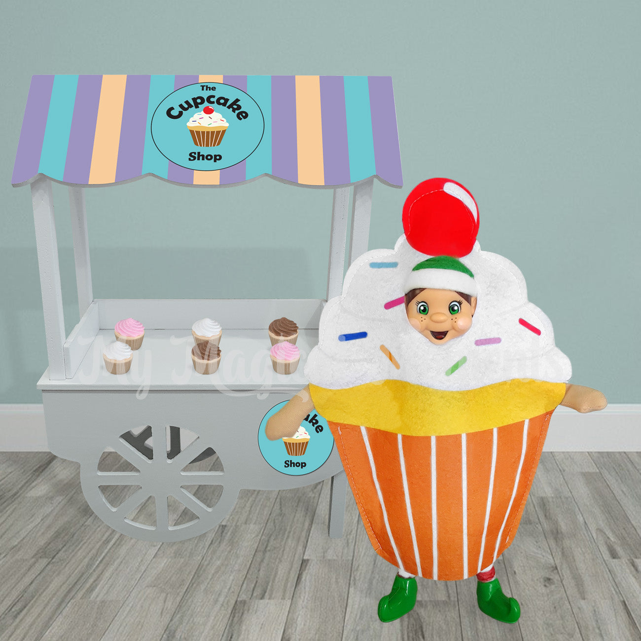 Elf dressed as a cupcake selling miniature cupcakes at her shop
