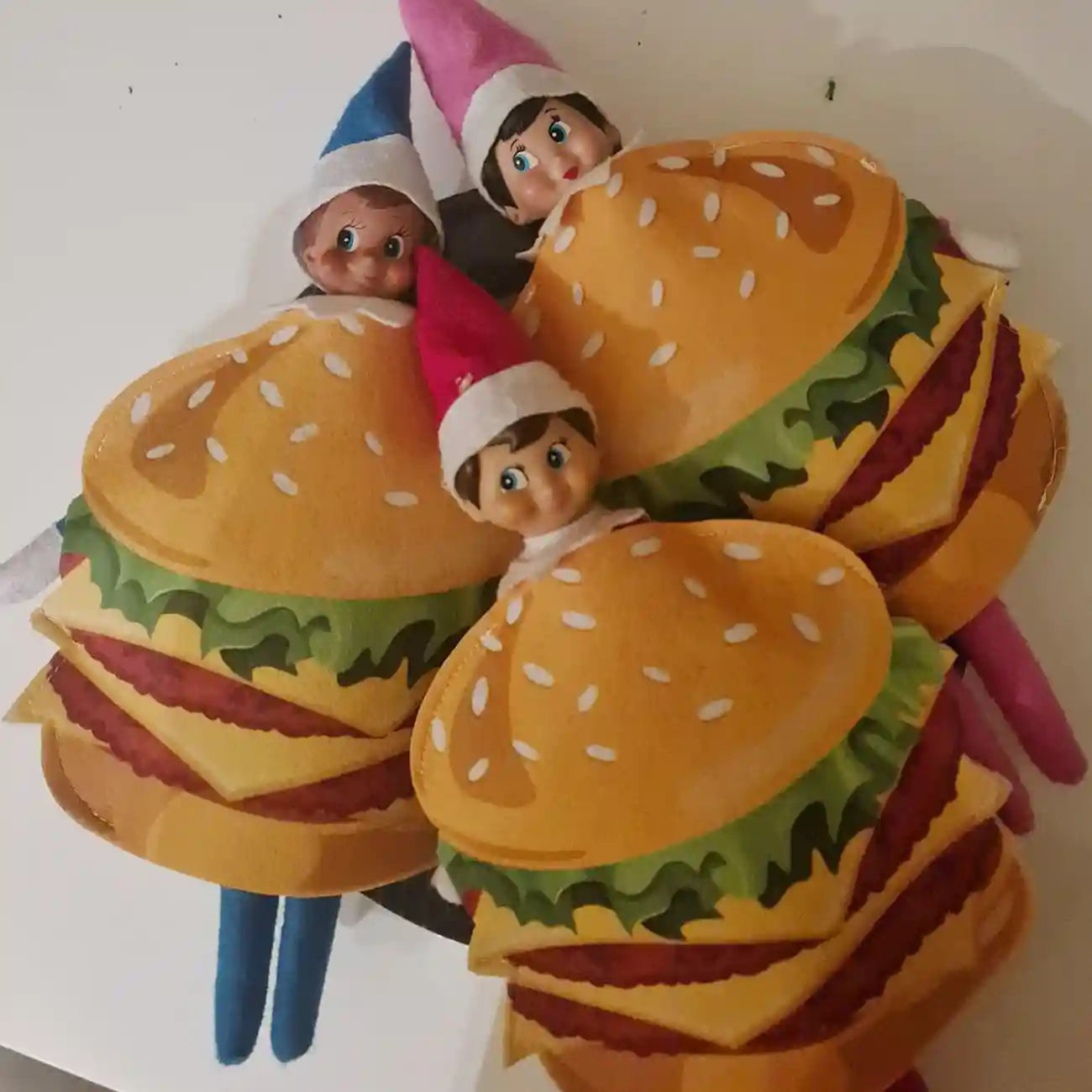 elf on the shelf dressed as a burger customer photo