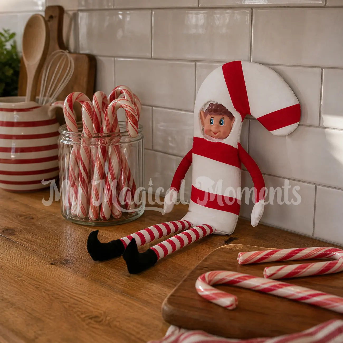 Elves Behavin Badly Dressed as a Candy Cane in a kitchen with candy canes