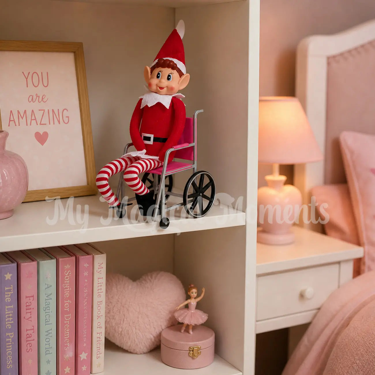 elves behavin badly in a pink wheel chair elf prop