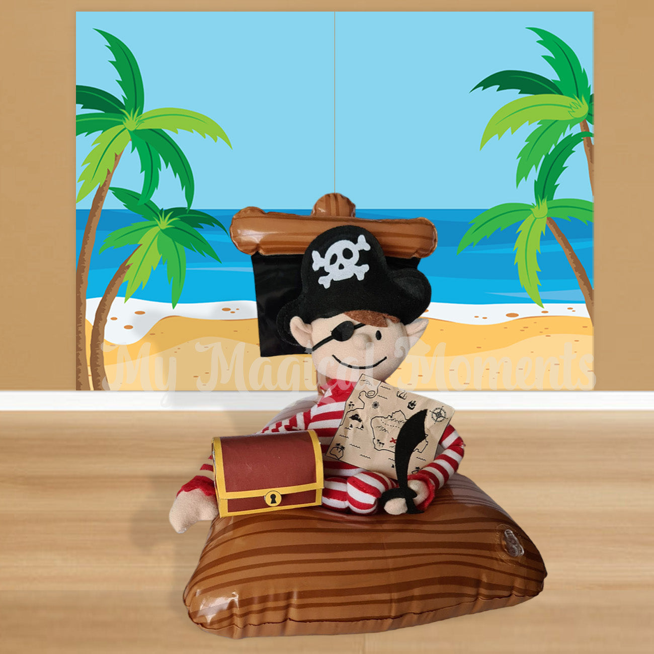 Elf For Christmas in an inflatable pirate ship with a printable map and treasure chest. Wearing a pirate costume