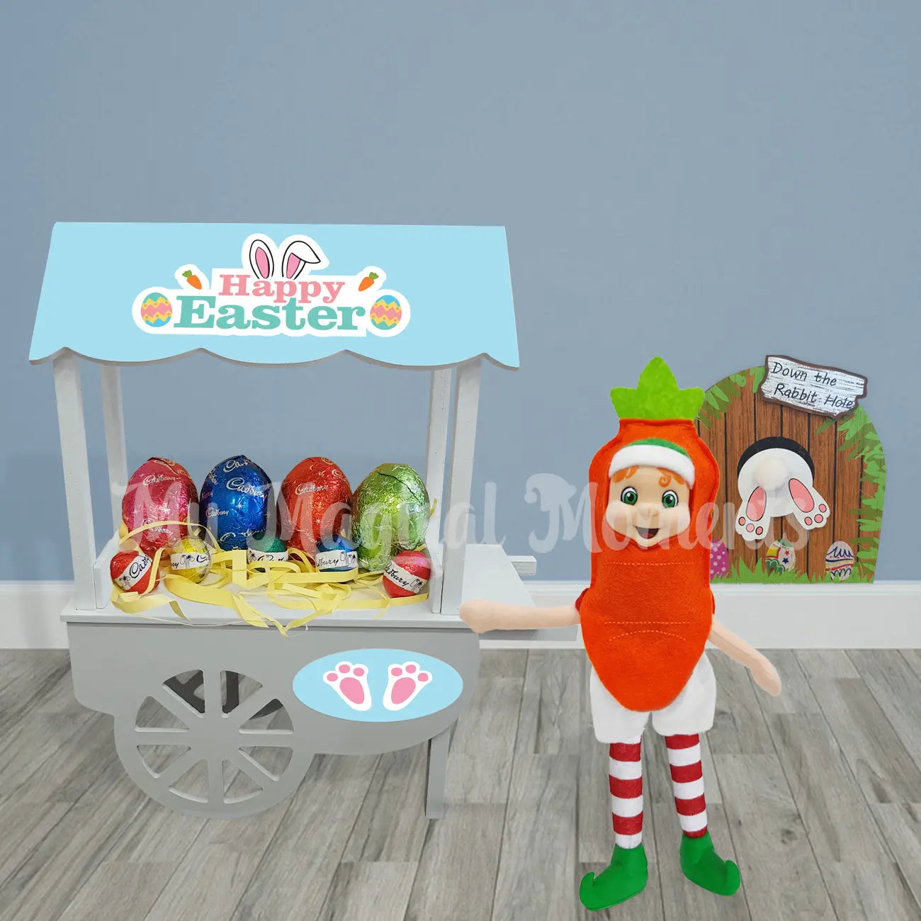 Elf wearing a carrot costume with an bunny easter door for easter display