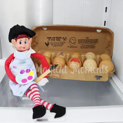 Elf wearing an artist costume painting eggs in the fridge