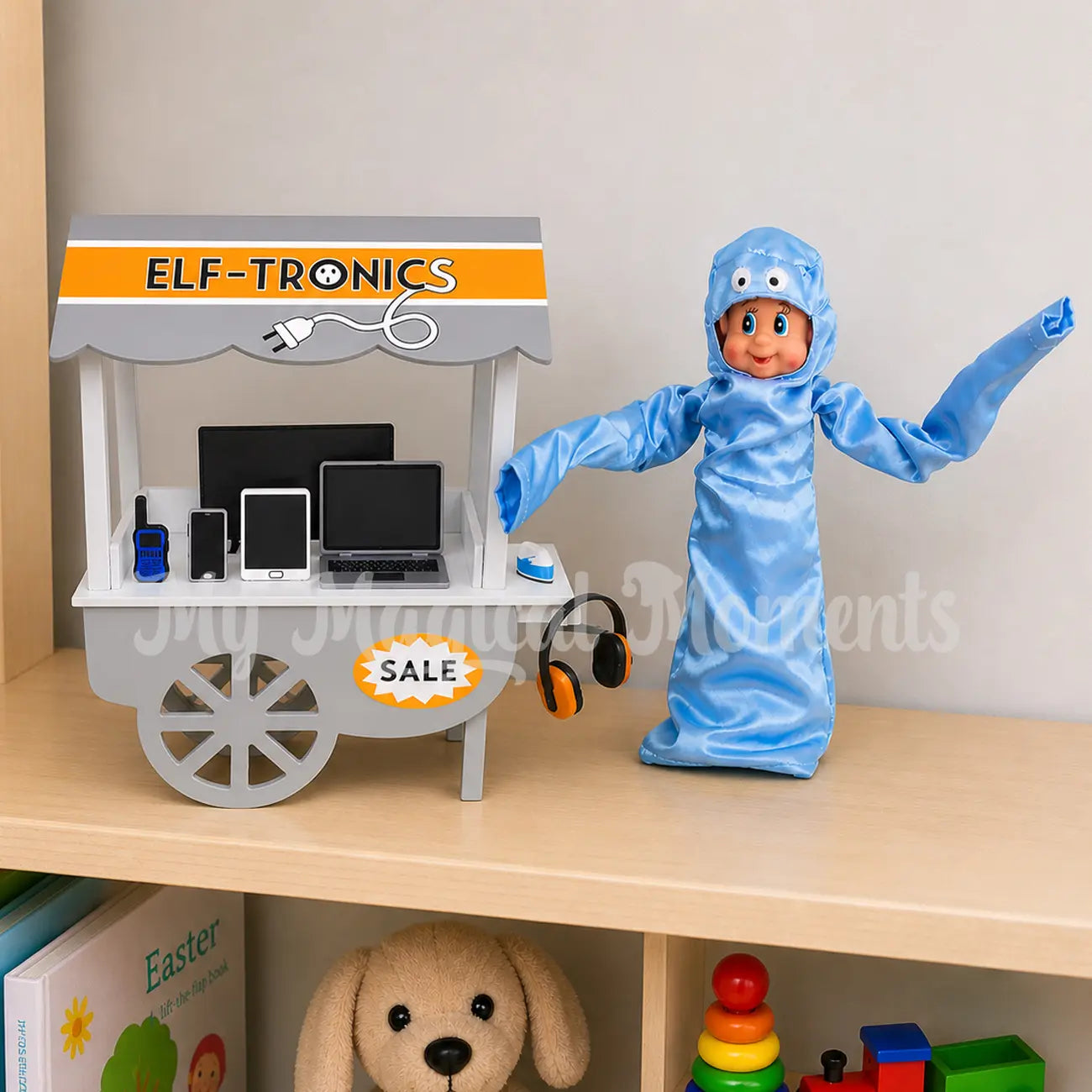 Elf dressed as a wacky inflatable arm waving salesman selling electrical goods