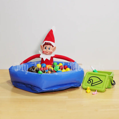 Elves behavin badly playing in an inflatable ball pit with m&ms and a small container with an axolotl fidget, a rubber duck and a water gun