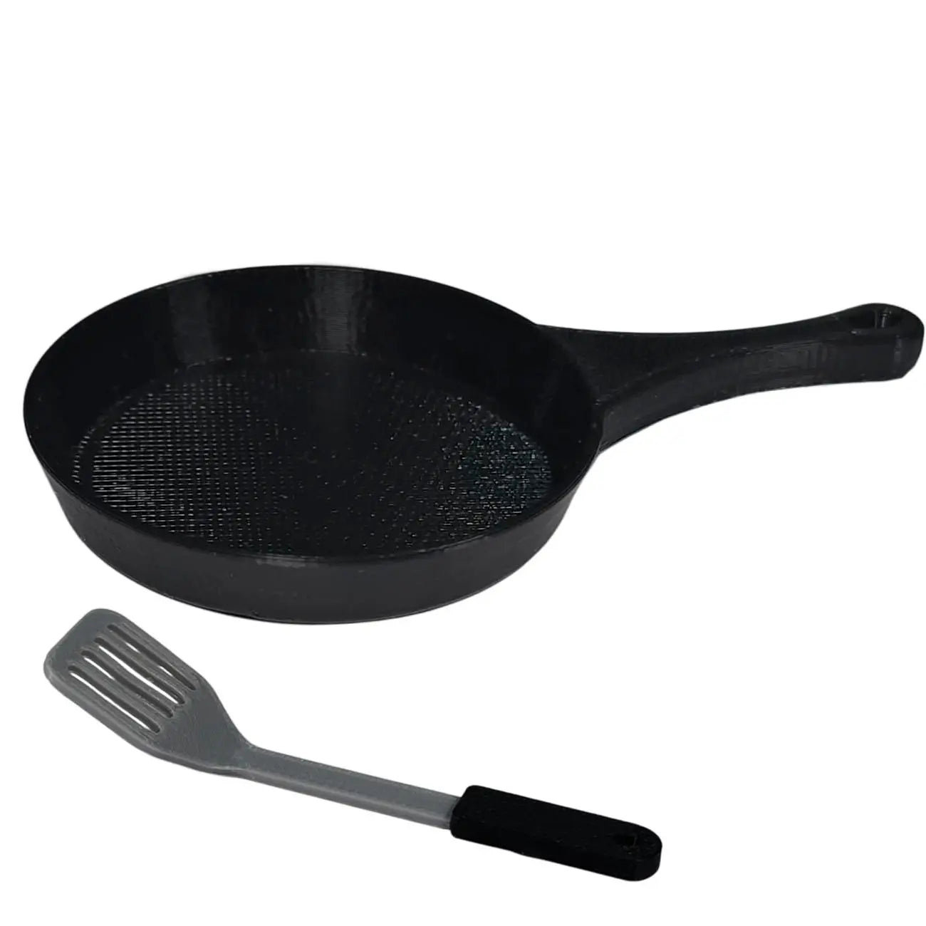 Elf Prop Black frying pan with a spatula on a white background