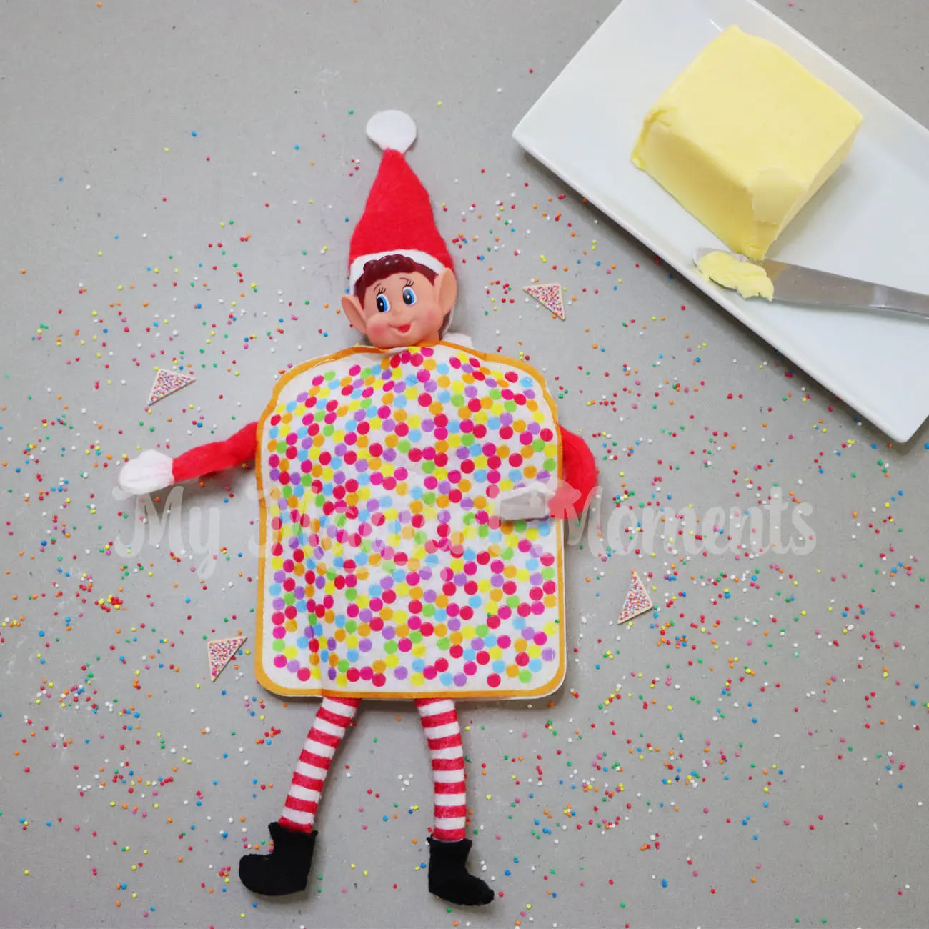 Elf wearing fairy bread costume with mini fairy bread around them