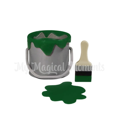 Elf Sized paint bucket with green paint and brush on a white background