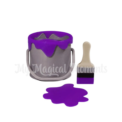 Elf Sized paint bucket with Purple paint and brush on a white background