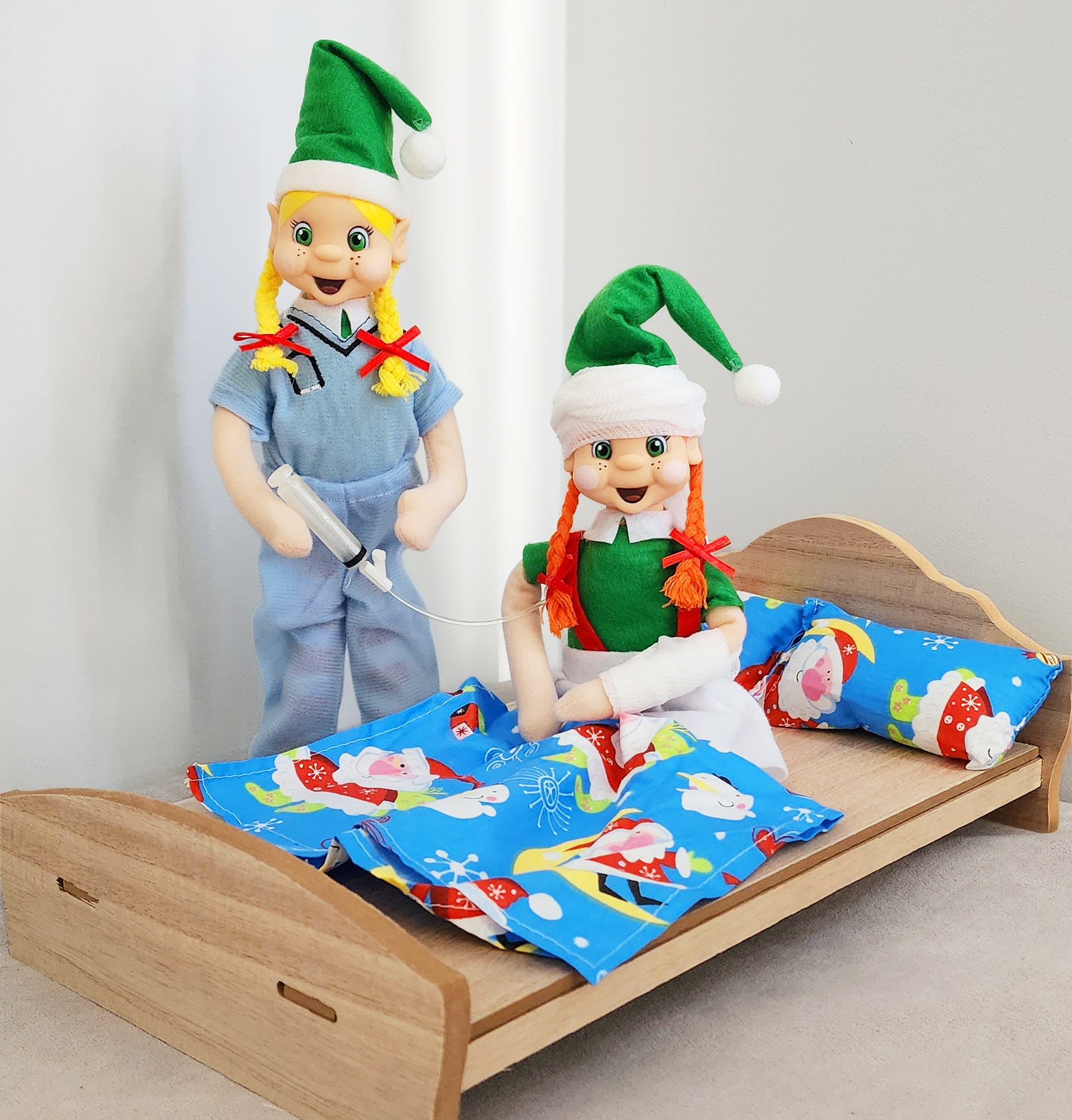 Elf recovering from an injury with feeding tube and bed props