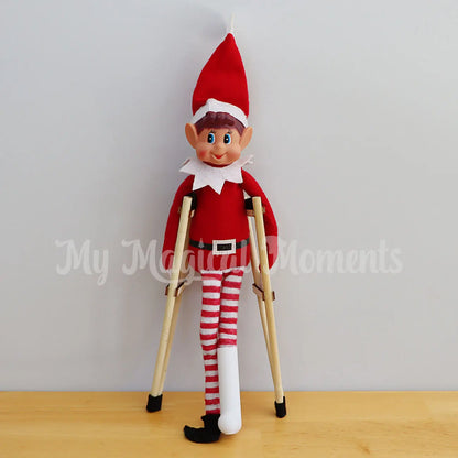 elf with a mini broken leg cast and mini crutches props