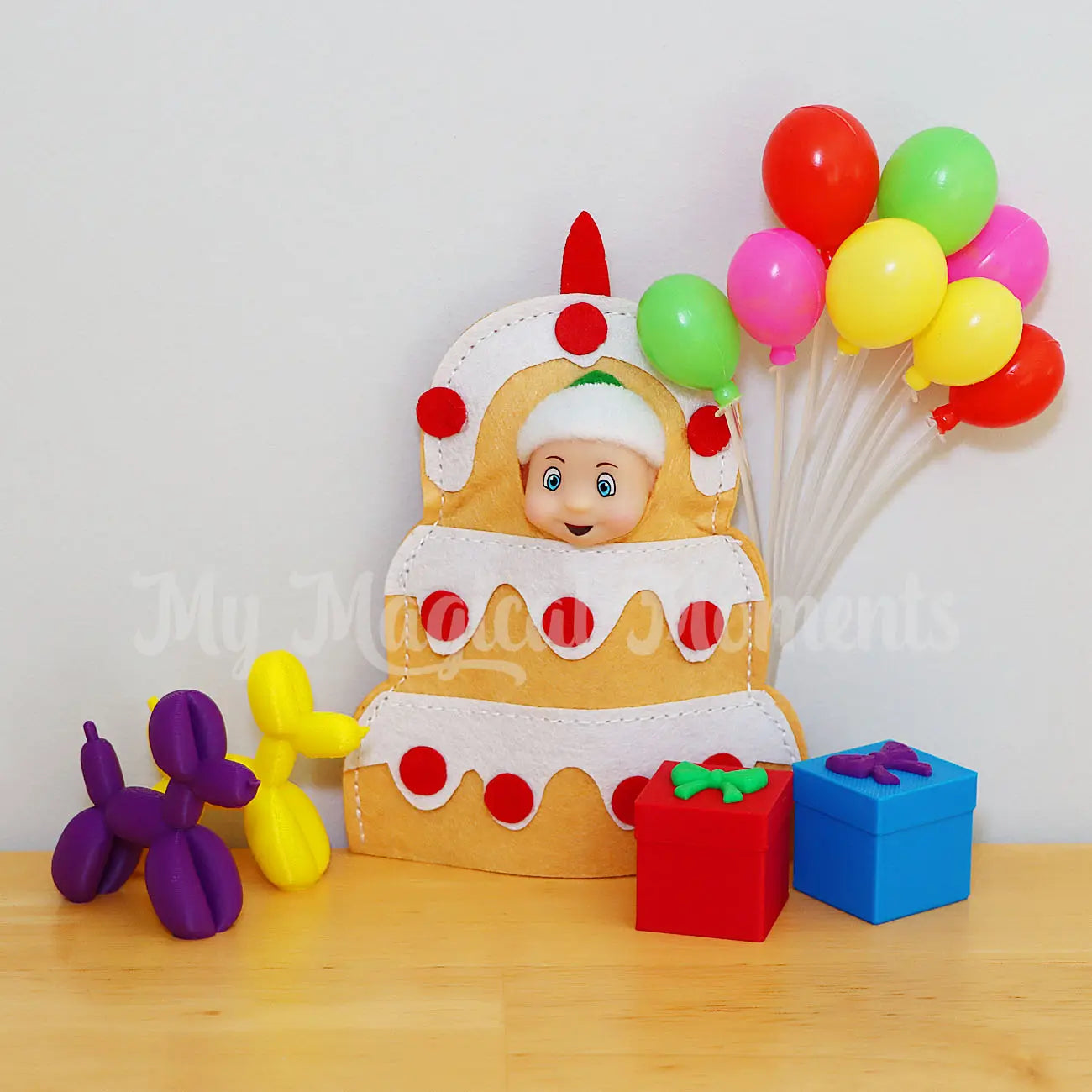 Elf baby wearing a cake costume celebrating a birthday