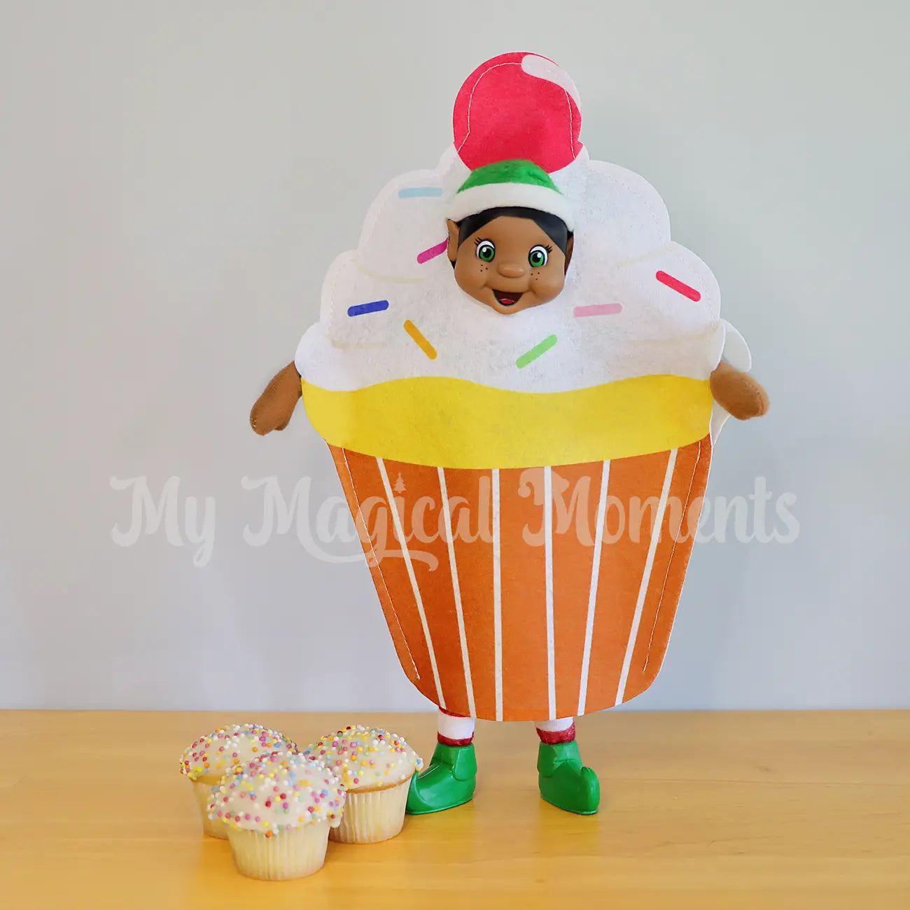 elf wearing a cupcake outfit with mini cupcakes