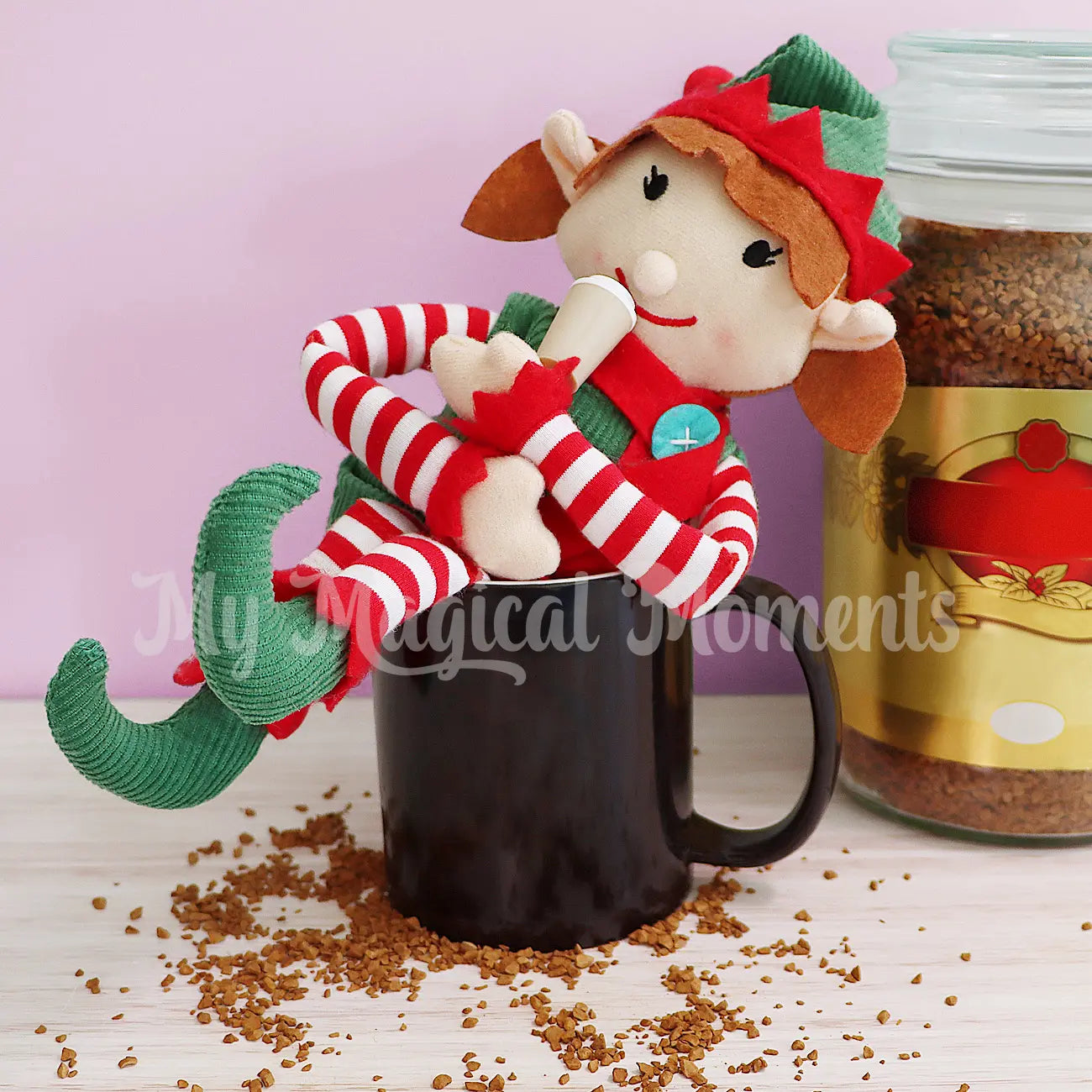 Elf for christmas drinking a mini coffee elf prop