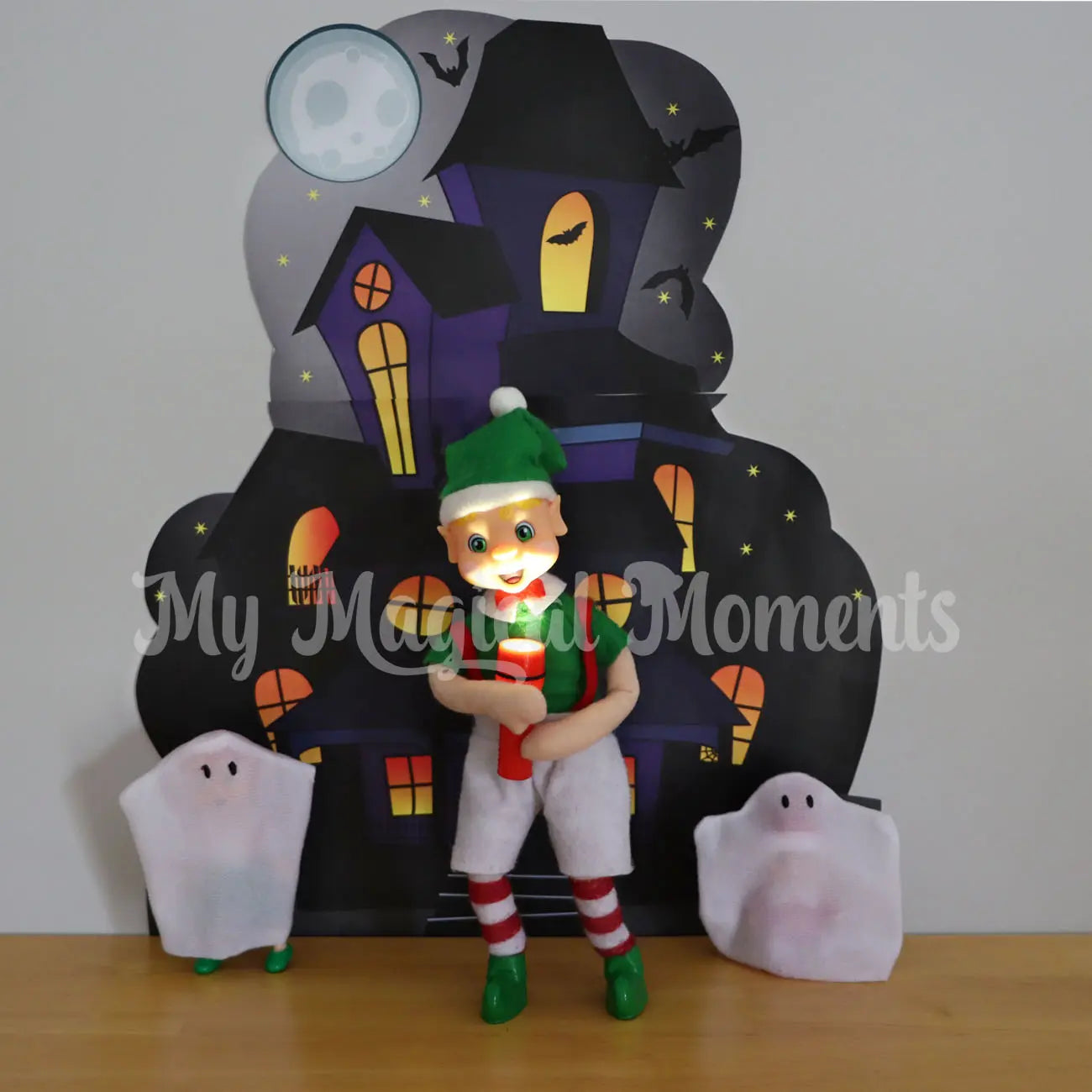 Spooky elf scene with a haunted mansion printable an elf playing with a torch and elf baby ghost and toddler elf ghost