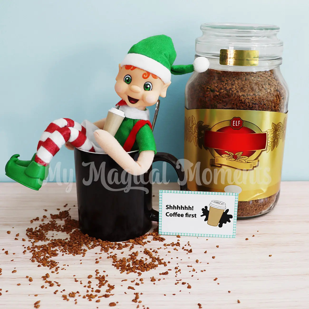 Orange Hair Bendable Elf sitting in a mug drinking coffee 