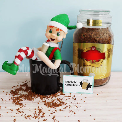 Orange Hair Bendable Elf sitting in a mug drinking coffee 