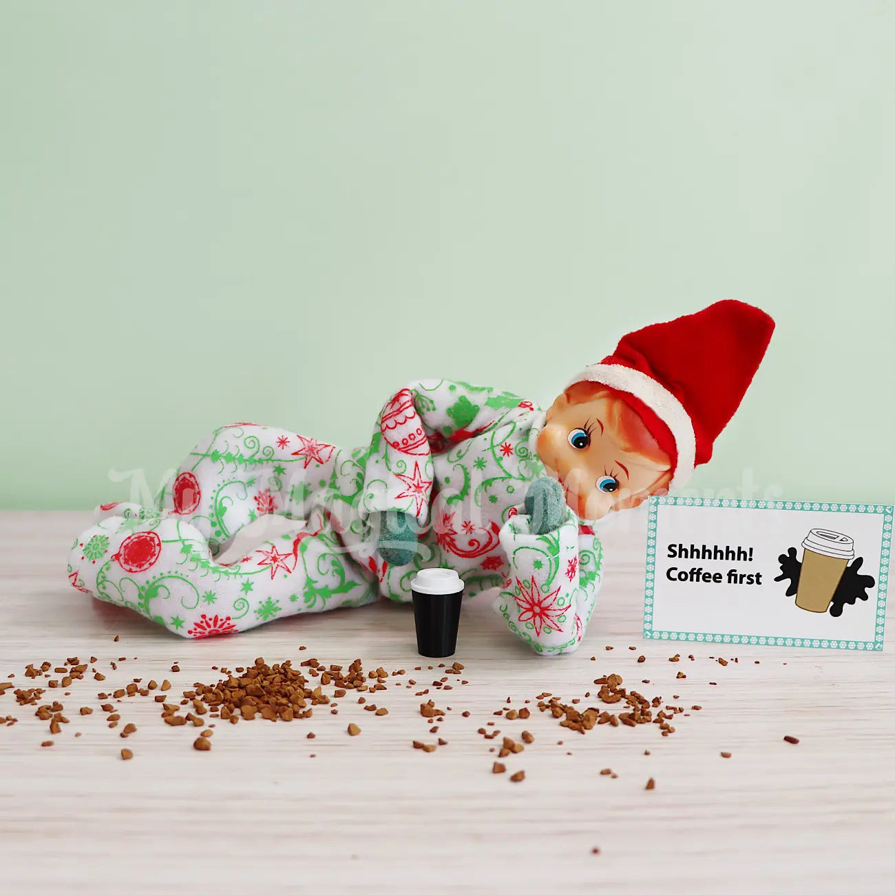 Elf wearing Pajamas drinking morning coffee  