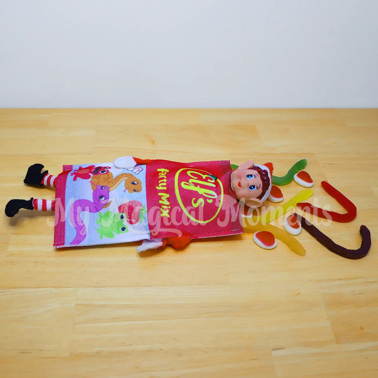 elf wearing a lollie bag costume with lollies around them