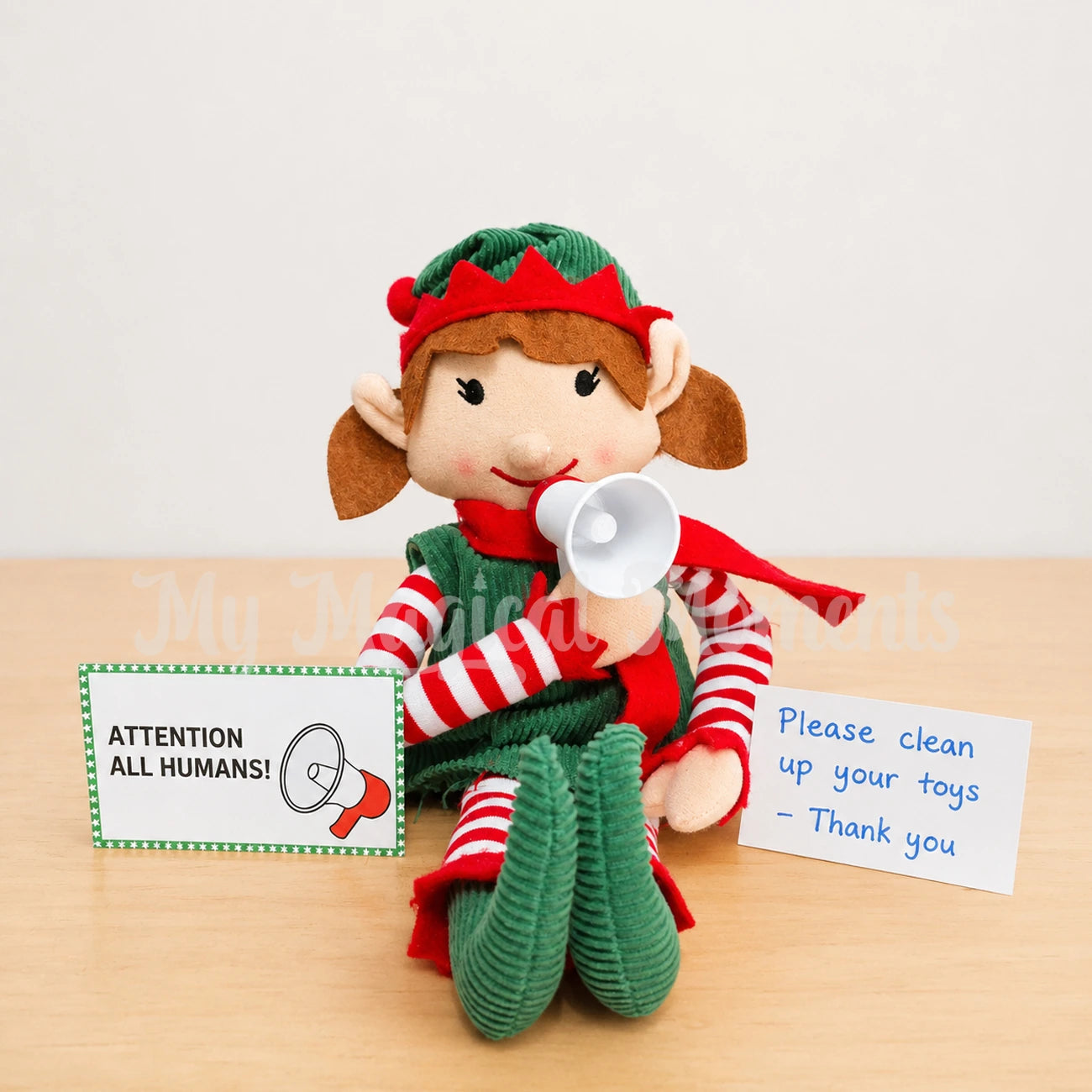 elf holding a mini megaphone, telling the kids to clean up