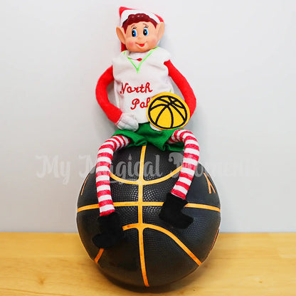 elf wearing a basketball uniform sitting on a basketball