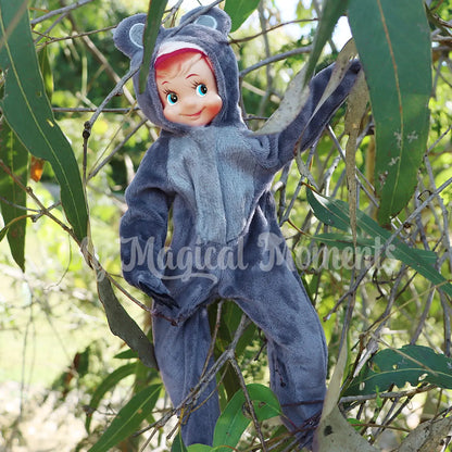 Elf in a tree wearing a koala outfit