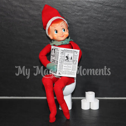 Elf on the Shelf sitting on a toilet reading a newspaper against a dark background