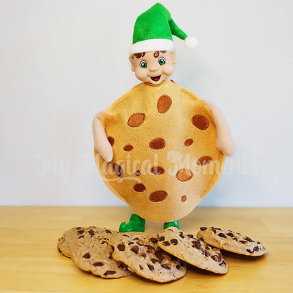 elf wearing a cookie outfit with choc chip cookies