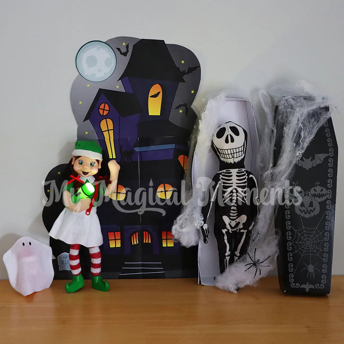 Elf at a haunted mansion with a flashlight, baby elf ghost and a skeleton elf